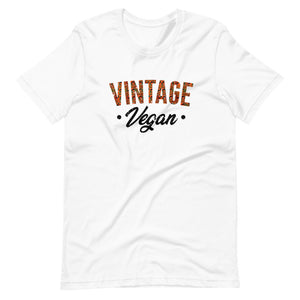 White colored t shirt , this Vintage Vegan t-shirt is all about going old school and eating and living well, this t shirt is soft, lightweight, and good stretch. Comfortable, flattering for all gender.