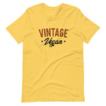 Yellow colored t shirt , this Vintage Vegan t-shirt is all about going old school and eating and living well, this t shirt is soft, lightweight, and good stretch. Comfortable, flattering for all gender.